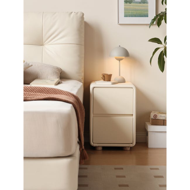 Nolan King Storage Bed in Silver Fox with 2 Asher Narrow Bedside Table - 19 - Cream-colored bed with textured pillow, brown