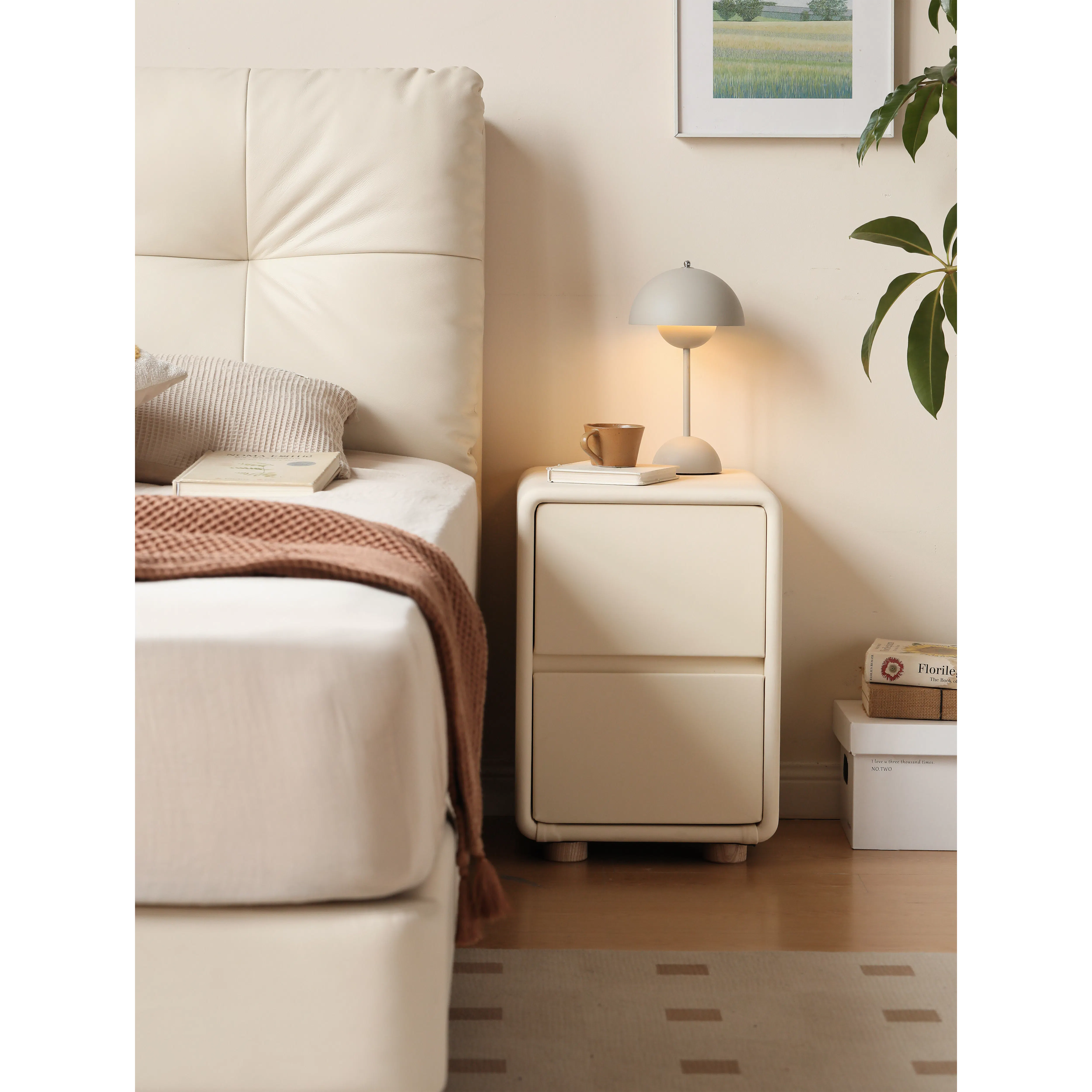 Nolan Queen Storage Bed in Oatmeal with 2 Asher Narrow Bedside Table - 18 - Cream-colored bed with textured pillow, brown
