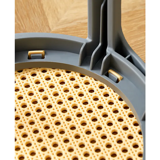 Eddie Stackable Stool - Black - 6 - Honeycomb-patterned surface, Wooden table background, Plastic mold with holes, Food item