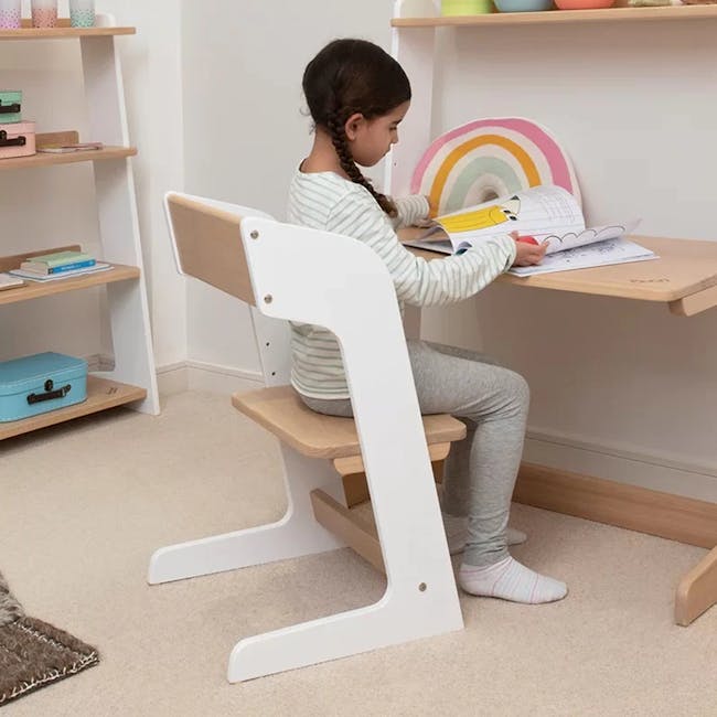 Natty Adjustable Study Desk 0.9m - White, Almond - 7 - child sitting at modern wooden desk, girl reading book, colorful