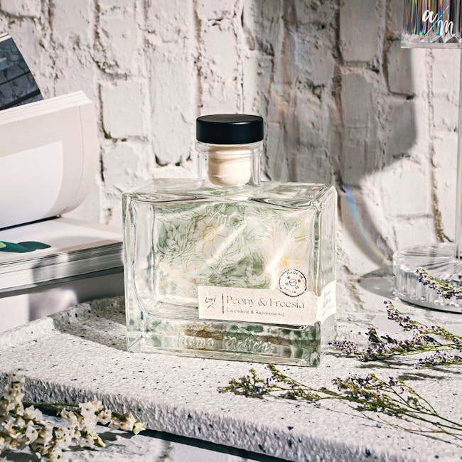 Aroma Matters Reed Diffuser - Peony & Freesia (2 Sizes) - 4 - Clear glass bottle, botanical design, "Pony & Freesia" label