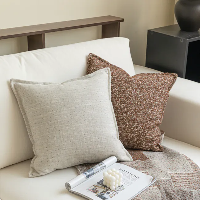 Gregori Linen Specks Cushion Cover - Grey - 2 - Cream and brown textured pillows, beige sofa, soft lighting, modern decor