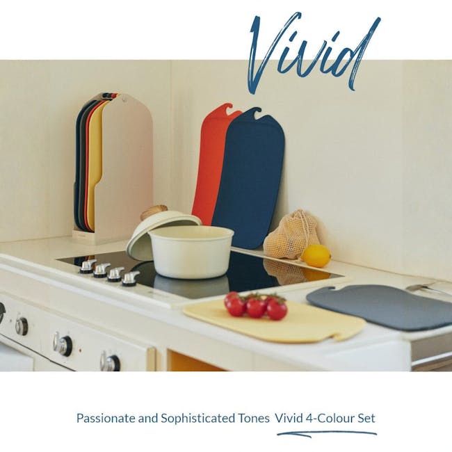 Modori Cutting Board - Navy - 2 - Vibrant kitchen countertop design, Colorful cutting boards on the stove, Fresh fruit on