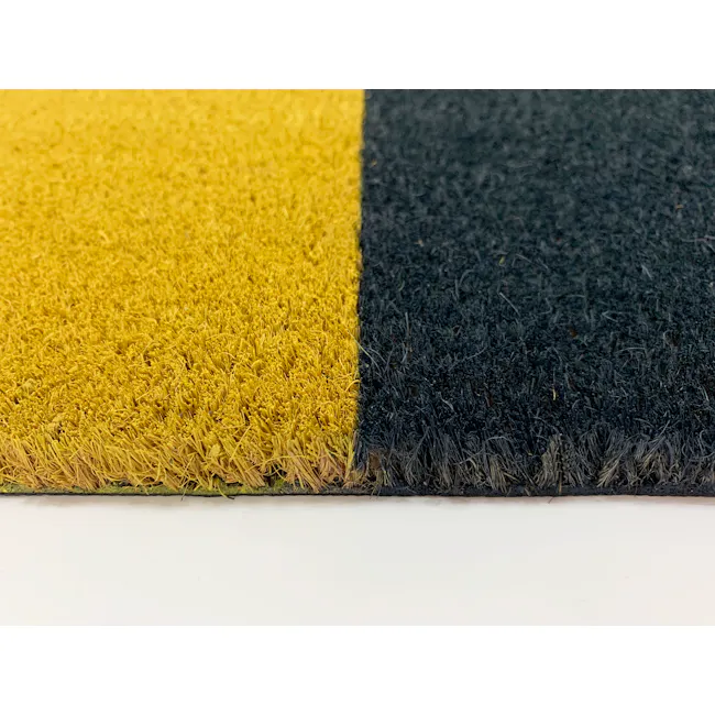 Quent Coir Door Mat - 3 - Yellow and black carpet, close-up view, textured surface, fluffy material, natural fiber, coarse