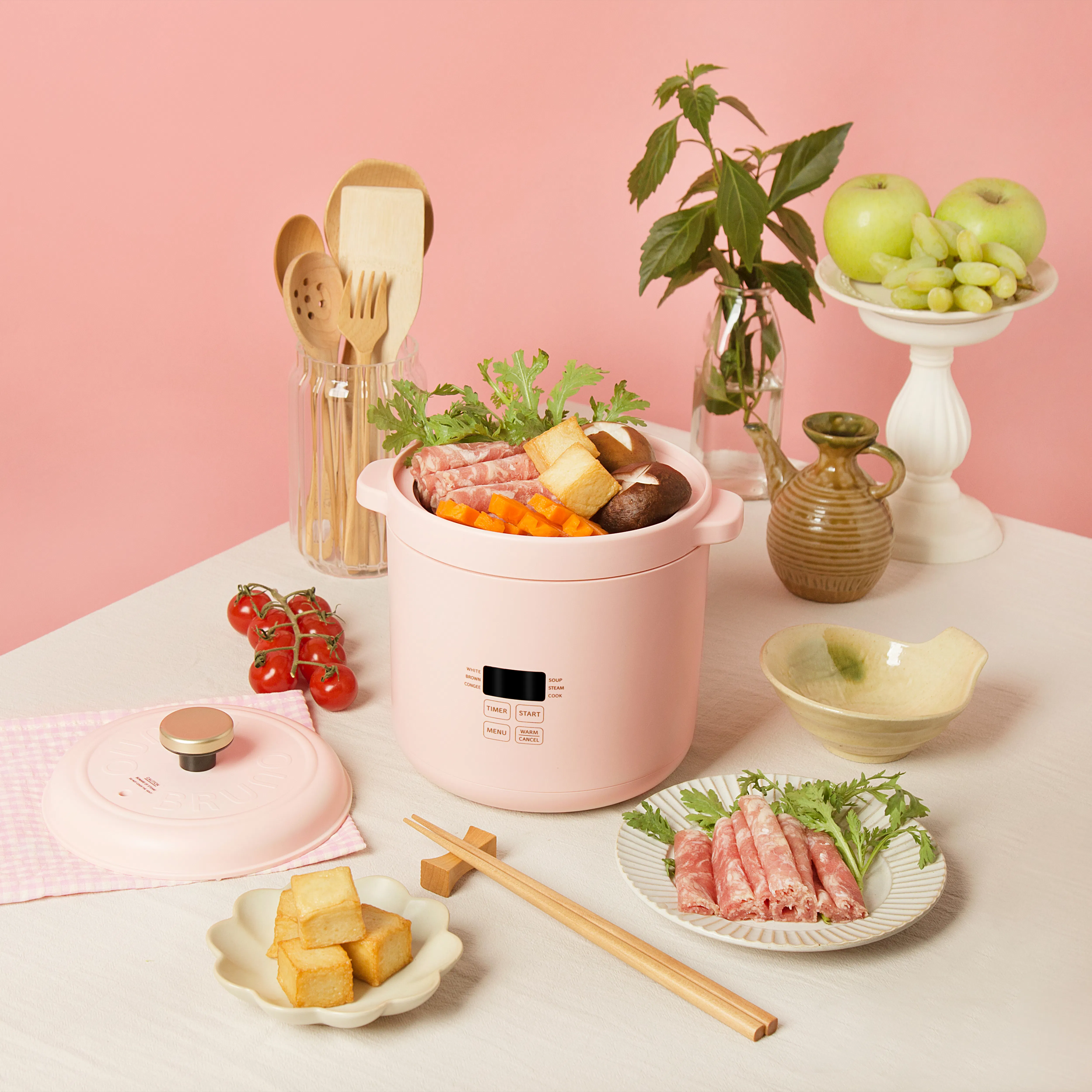 Bruno Mini Rice Cooker - Pink - 9 - wooden kitchen utensils, pink background, wooden cutting board, green apples, fresh