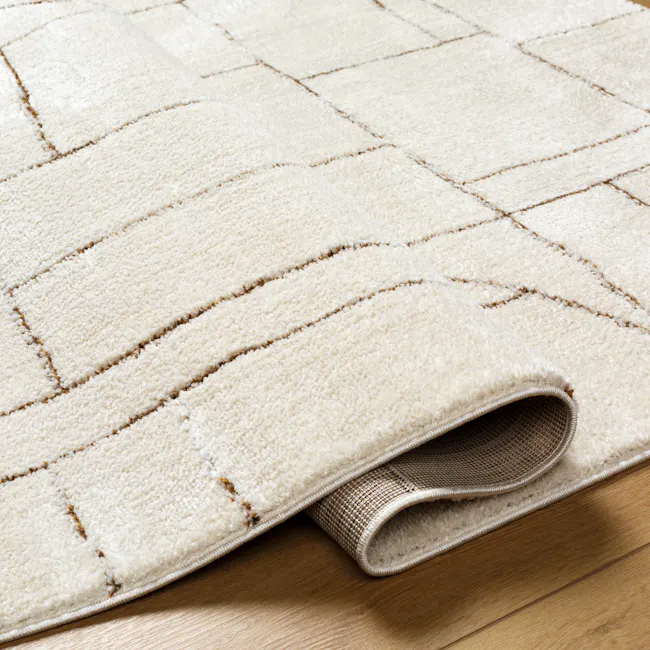 Adler Low Pile Geometric Rug - Walnut (3 Sizes) - 3 - White textured rug with intricate geometric pattern, partially