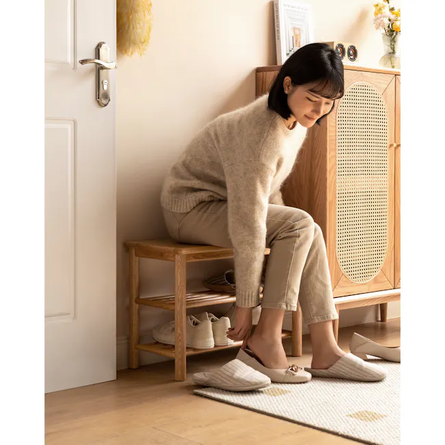 Azumi Shoe Rack Bench 0.6m - Oak - 2 - Cream sweater, beige pants, wooden stool, light beige shoes, woman sitting, entering