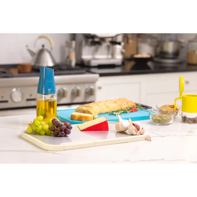 Zuutii 2-in-1 Chopping Board (Light Cream) - 6 - Grapes, cheese, bread, garlic, olive oil, yellow container, yellow lid