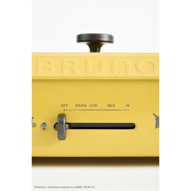 BRUNO Pokémon Compact Hot Plate - 4 - Yellow suitcase, "Bruno" embossed, control panel, "OFF, " "WARM, " "LOW, " "MED, "