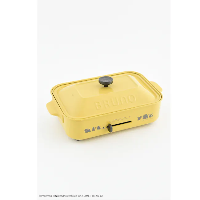 BRUNO Pokémon Compact Hot Plate - 8 - Yellow kitchen appliance, branded "Bruno, " lid with knob, control panel with icons