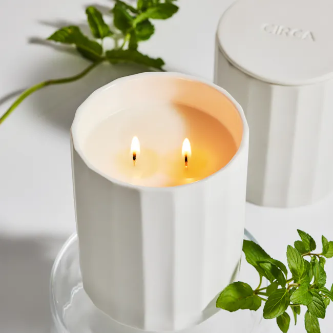 Circa Alchemy Soy Candle 350g - White Tea & Wild Mint - 2 - White candle with two lit wicks, soft glow, minimalist design