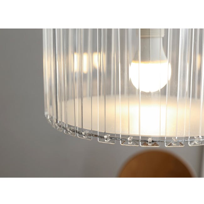 Acril Lampshade - 4 - Clear glass lampshade, warm light, vertical lines, translucent material, soft glow, ambient lighting