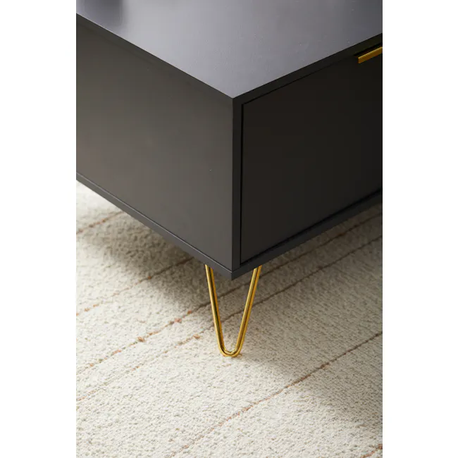 Volos Coffee Table - 9 - Modern black coffee table with gold legs, minimalist design, sleek surface, textured carpet