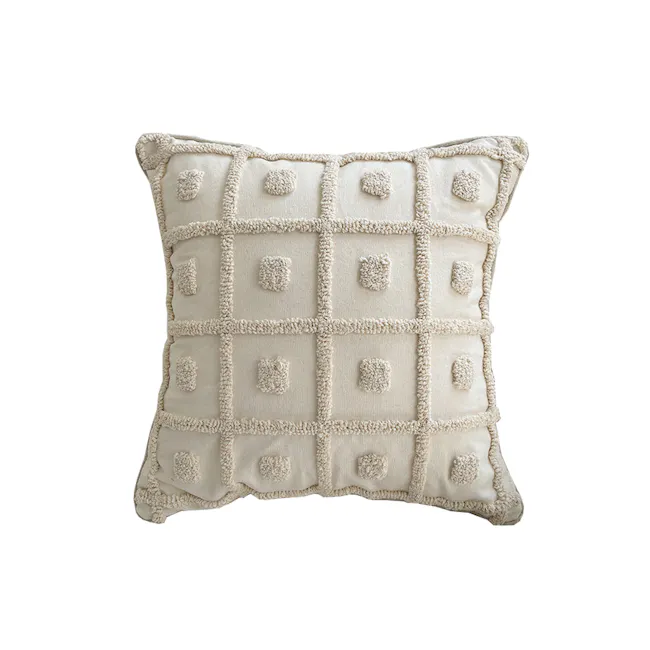 Alaia Cushion - 1 - Cream-colored, plush, decorative pillow with textured edges, square shape, six-pointed pom-poms, soft
