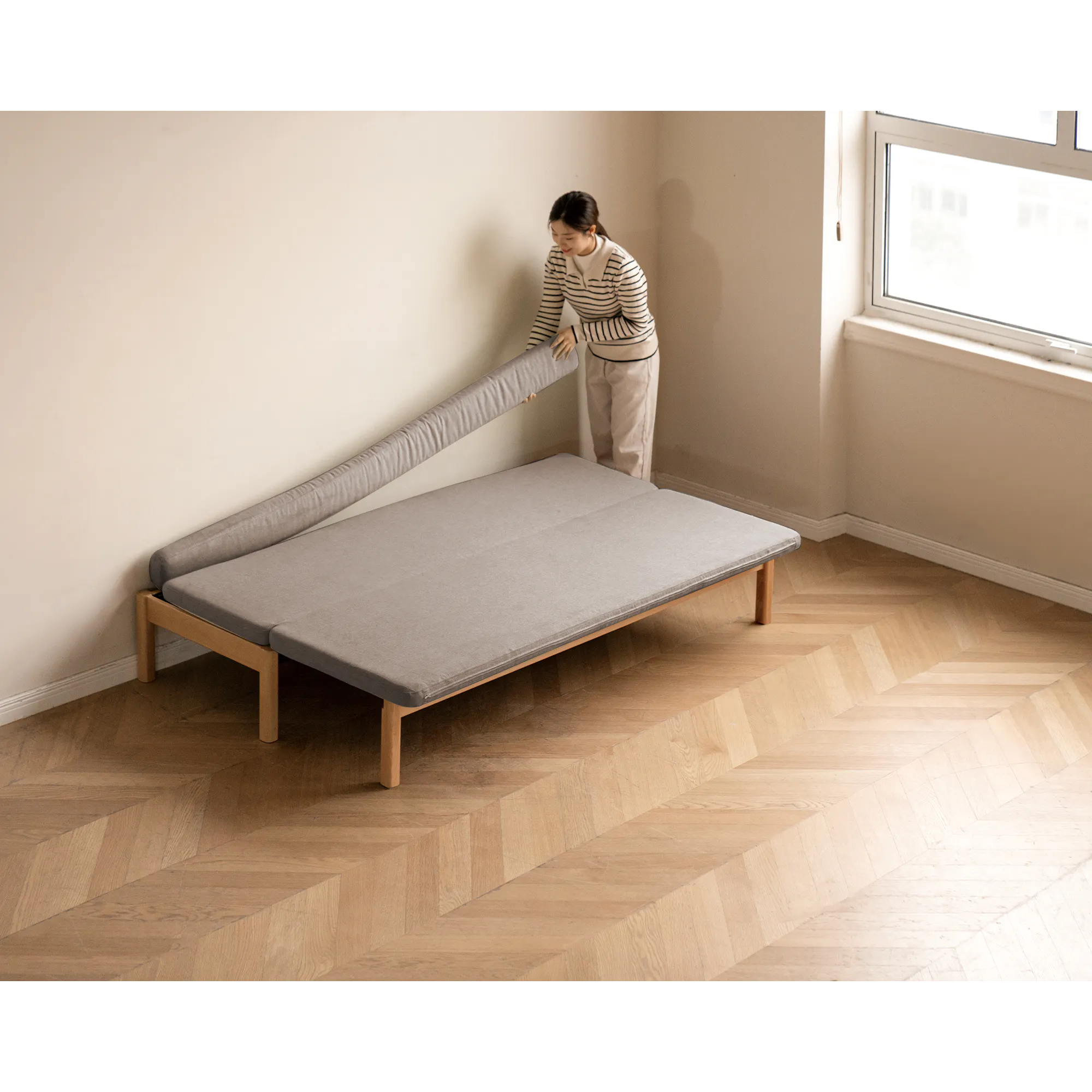 Cleo Sofa Bed / Bench 2m - Chestnut - 11 - Modern minimalist bedroom, light beige walls, wooden floor, herringbone pattern
