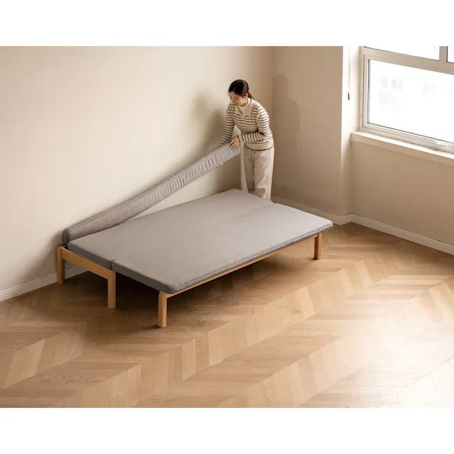 Cleo Sofa Bed / Bench 2m - Chestnut - 11 - Modern minimalist bedroom, light beige walls, wooden floor, herringbone pattern