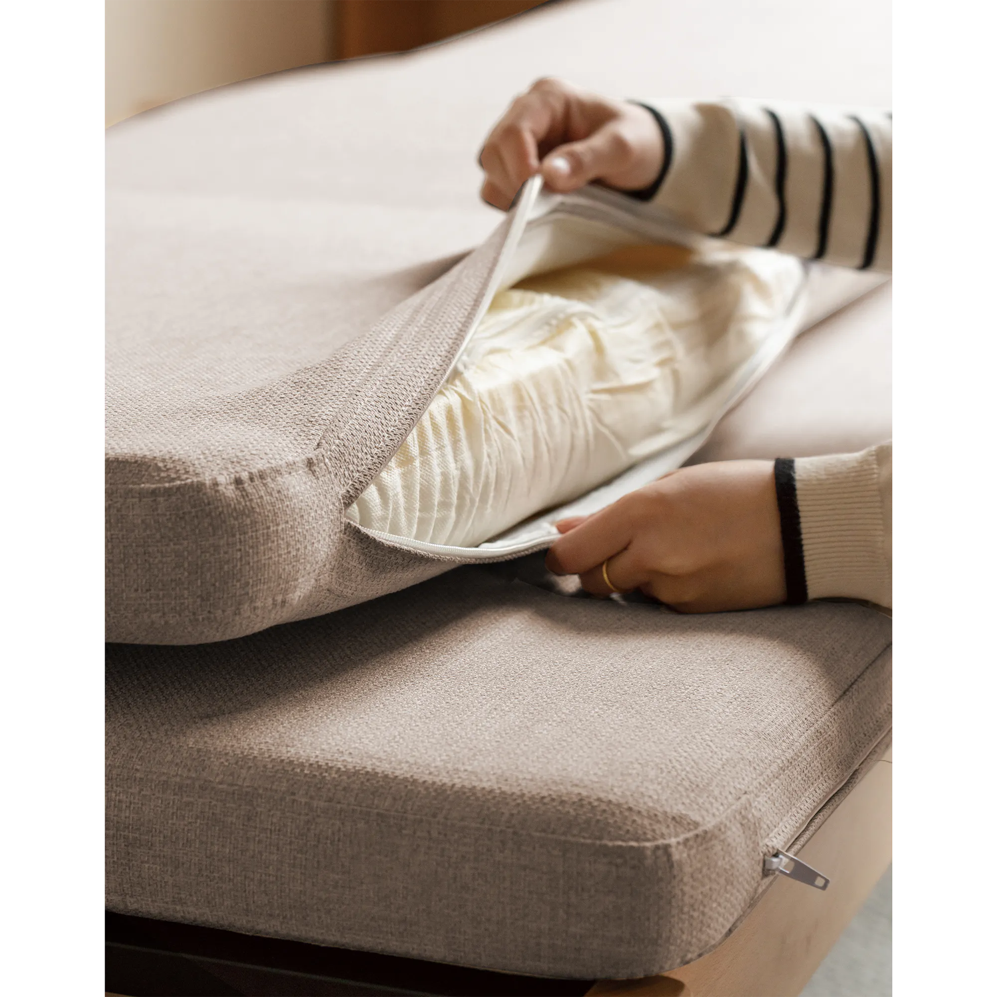 Cleo Sofa Bed / Bench 2m - Chestnut - 16 - Soft, beige, textured mattress, person unzipping mattress, hands pulling zipper