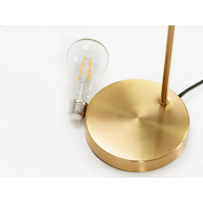 Oro Table Lamp - Brass - 3 - gold lamp, white background, modern design, sleek finish, transparent light bulb, orange