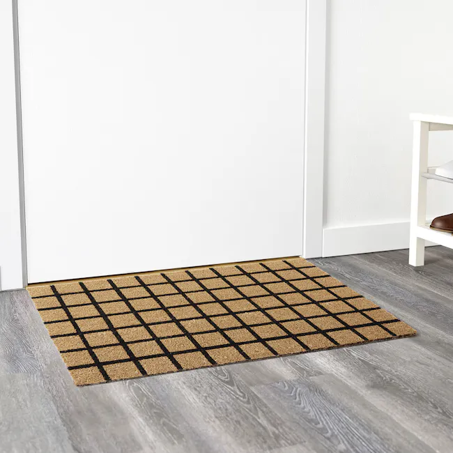 Mattie Coir Door Mat - 2 - Barefoot rug, beige and black checkered, wooden floor, gray and white wall, white door frame