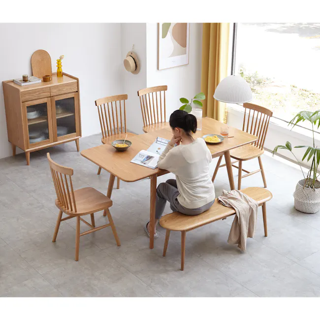 Felda Bench 1m - Oak - 10 - Wooden dining table, woman reading, modern furniture, minimalist decor, natural light, wooden