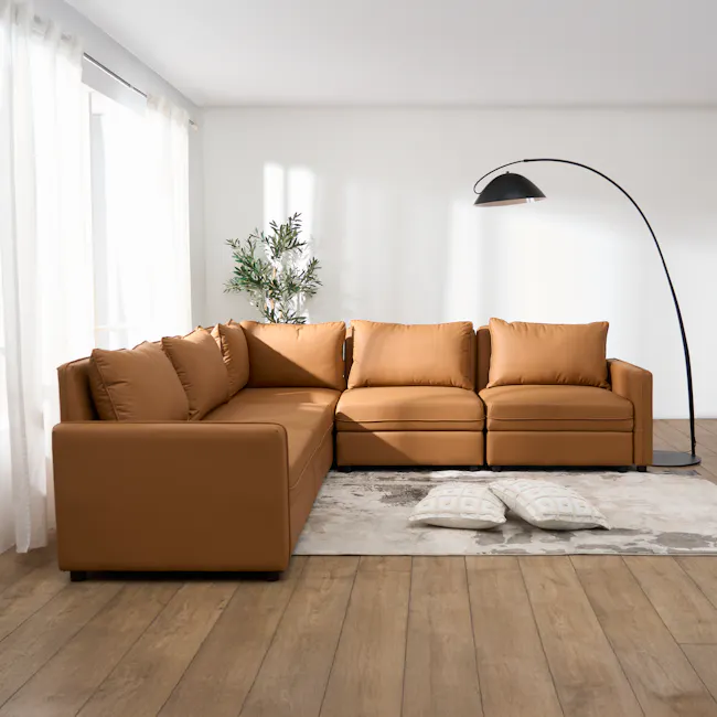 Cameron Corner Unit - Tan (Pet Friendly) - 10 - Modern living room with large brown leather sofa, floor lamp with black