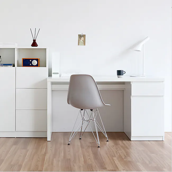 Flando Study Table 1.4m - 2 - White minimalist desk, modern chair, wooden floor, white shelving unit, small framed picture