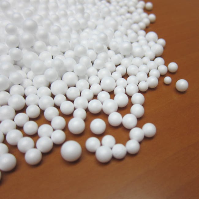 Mee Kids Bean Bag - Red - 3 - White spherical objects scattered across a wooden surface, numerous small spheres of varying