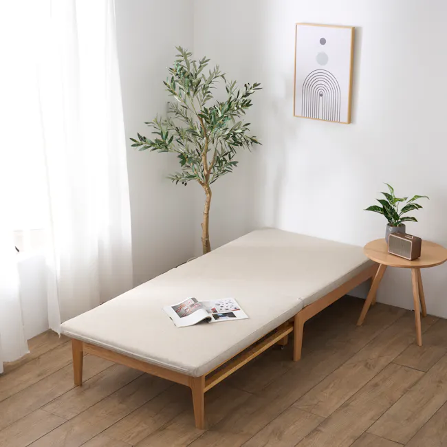 Mariel Lounge Sofa Bed - Gravel White - 5 - Minimalist room with white walls, natural light streaming through sheer