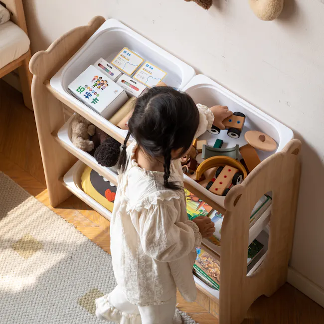 Aiko Wooden Kids Toy Storage Rack - 6 - Wooden play shelf, child's hand, colorful toys, stuffed animal, wooden shelf