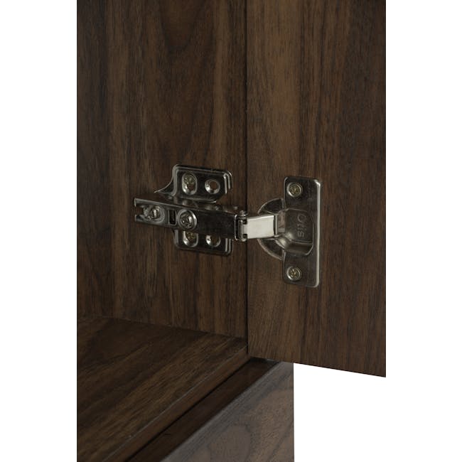 Carrie Tall Storage Cabinet - 8 - Wooden door with metal hinge, close-up view, dark brown wood grain, metal hinge, screws