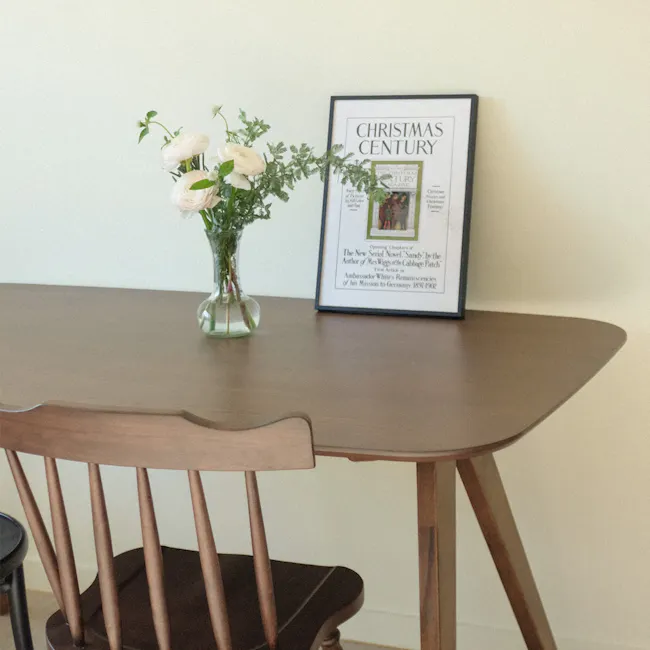 Anzac Dining Table 1.6m - Cocoa - 2 - vase with white flowers, wooden table, minimalist decor, framed magazine