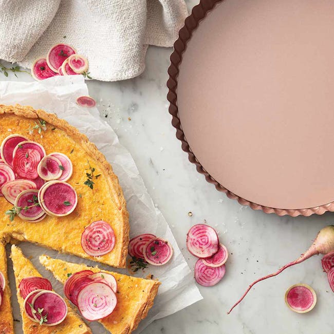 Wiltshire Rose Gold Quiche & Tart Pan - 2 - Beetroot tart with fresh radish slices, rustic presentation, vibrant colors