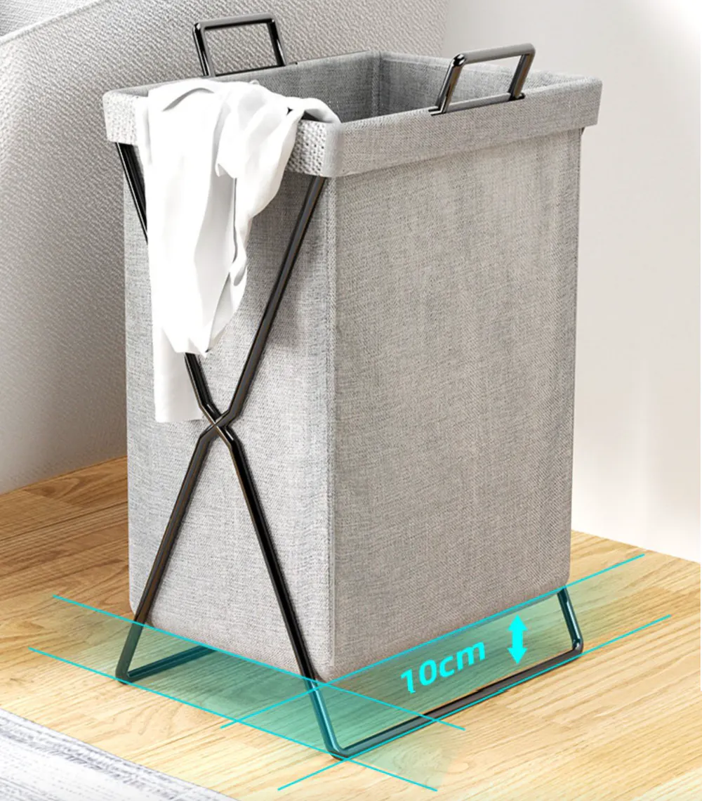 Nikki Laundry Basket - Black - 9 - Gray fabric laundry basket with black metal frame, white towel on top, transparent base