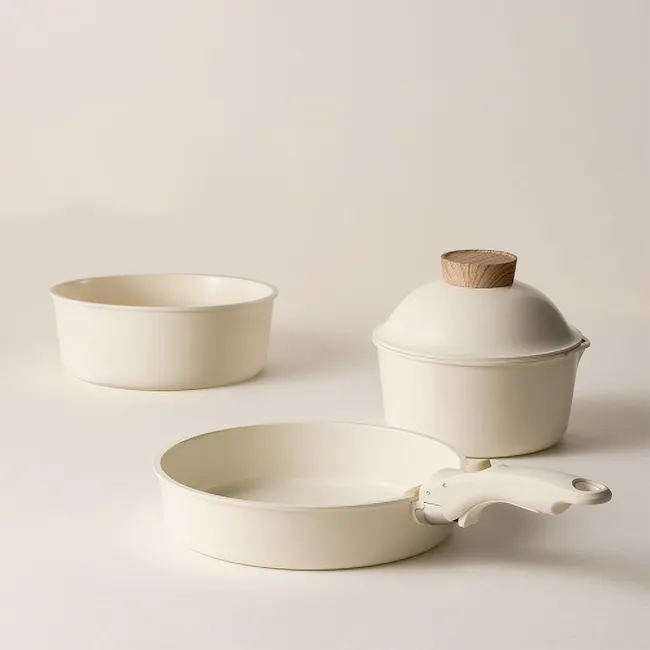Sodam Nonstick Cookware Set - Cream White - 5 - Cream-colored ceramic bowls, minimalist design, smooth surfaces, simple