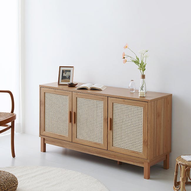 Belig Rattan Sideboard 1.3m - 5 - Wooden cabinet with woven design, light brown color, open shelf, small vase with flowers
