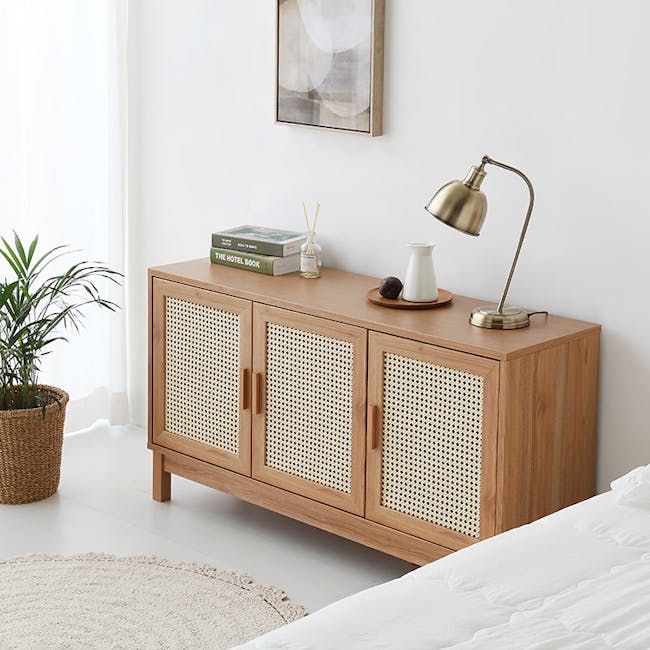 Belig Rattan Sideboard 1.3m - 4 - Wooden nightstand with woven design, minimalist decor, modern lamp, white wall, natural
