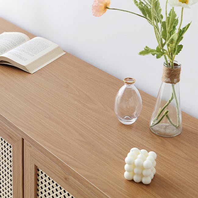 Belig Rattan Sideboard 1.3m - 11 - vase, flowers, book, table, natural light, wooden surface, minimalist decor, open book