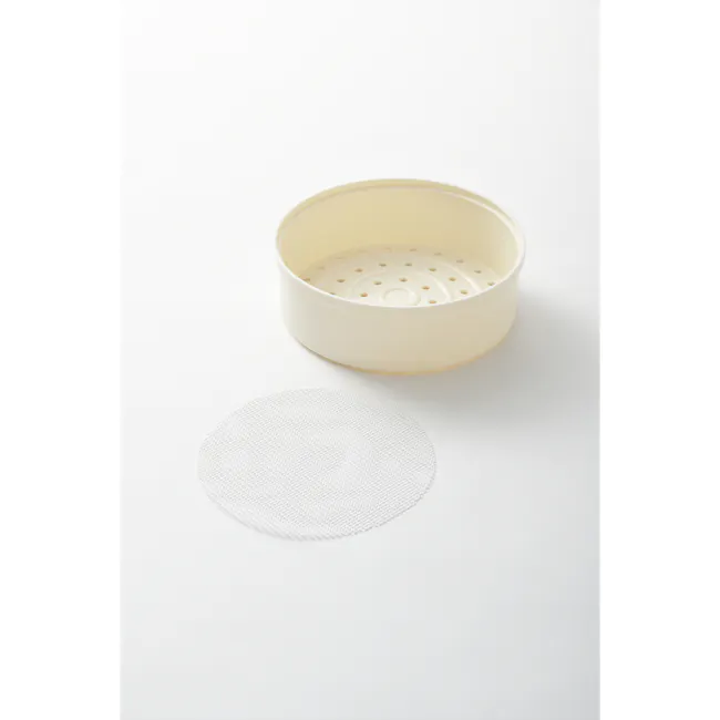 Bruno Mini Rice Cooker - Ivory - 4 - White ceramic colander, beige interior, perforated design, round base, flat top