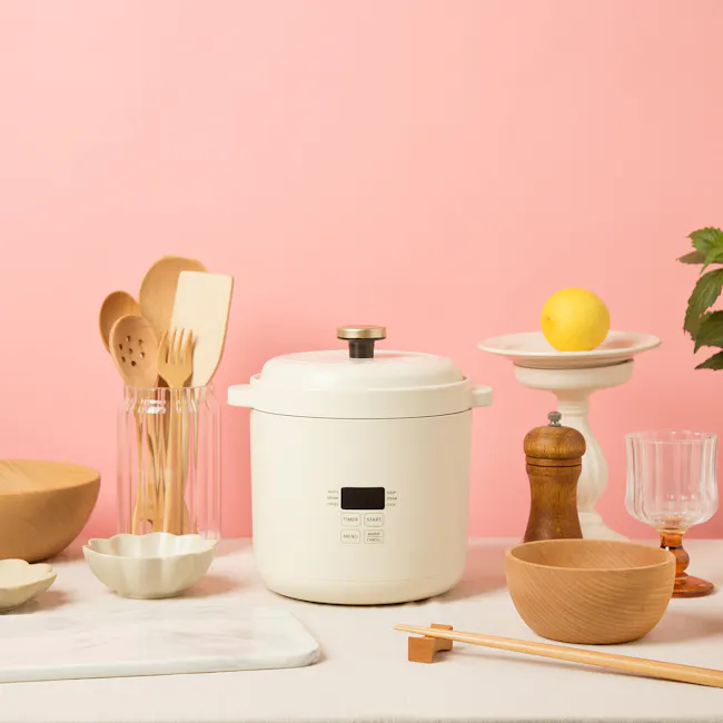 Bruno Mini Rice Cooker - Ivory - 9 - Wooden kitchen utensils, pink background, clear glass jar, wooden spoon, wooden