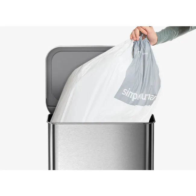 simplehuman Perfect Fit Liner 45L to 50L - N - 5 - trash bag, recycling bin, open trash can, person holding bag, plastic