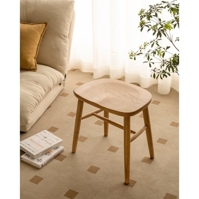 Pete Stool - Oak - 6 - Cream-colored sofa, mustard pillow, wooden stool, beige carpet, geometric pattern, natural light