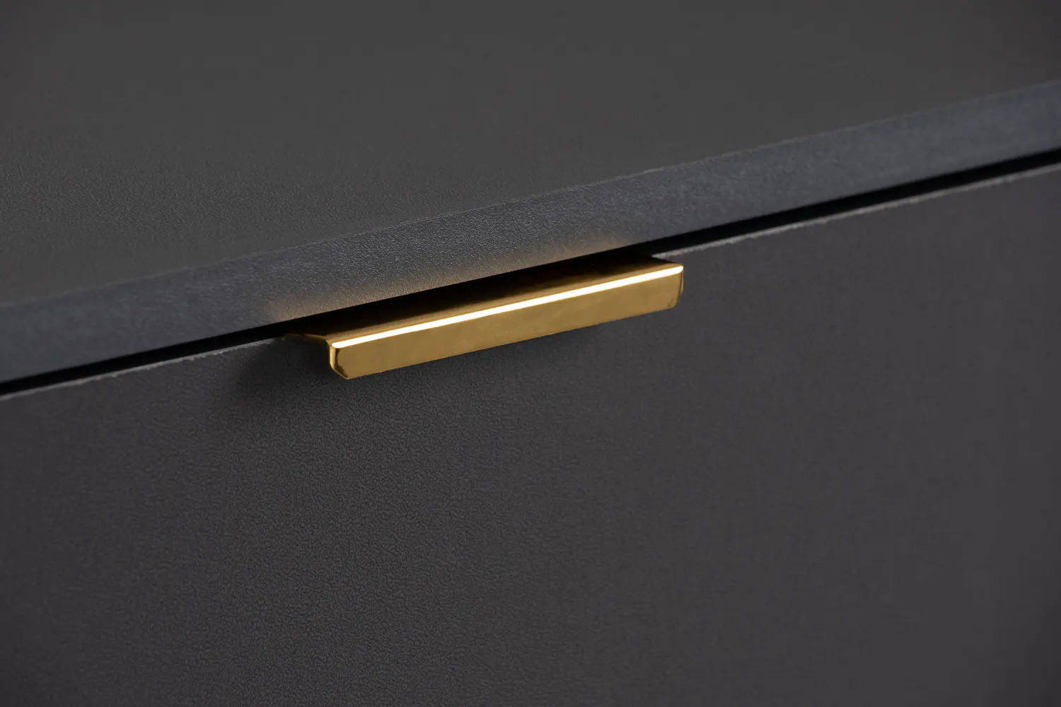 Volos Tall Cabinet 0.8m - 9 - Gold metallic drawer handle, sleek black surface, minimalist design, elegant contrast