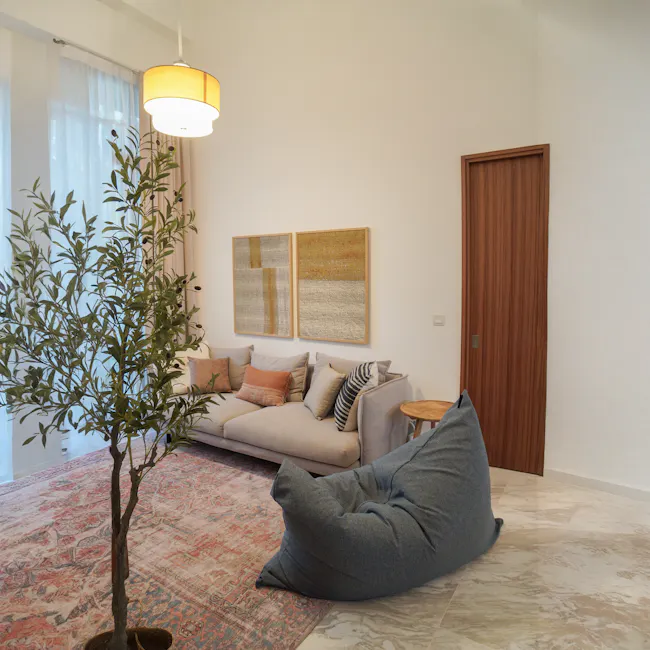 SoftRock Vesuvius Linen Rectangle Bean Bag - Deacon - 13 - Modern living room with beige sofa, abstract art on wall, wooden