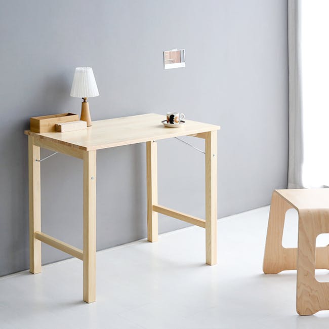 Perry Foldable Multipurpose Table 0.8m - 3 - Light wooden table, minimalist design, light gray wall, modern decor, simple