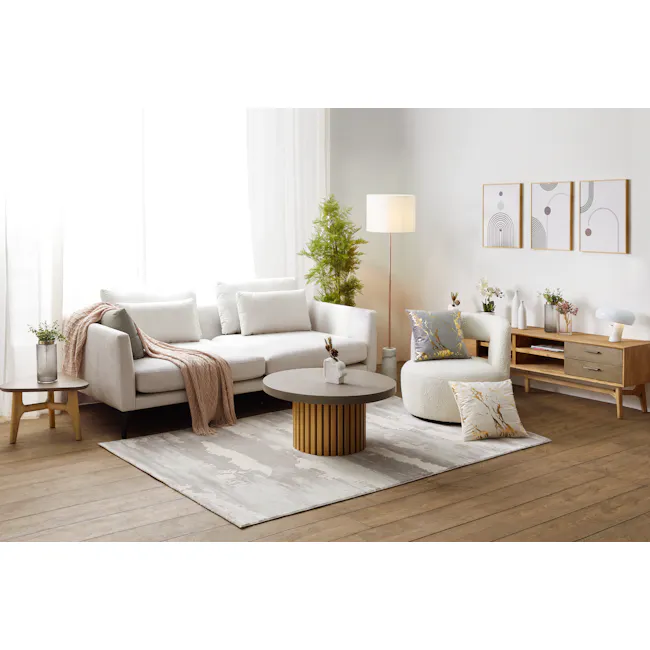 Aria Swivel Lounge Chair - 3 - Modern living room with minimalist decor, light-colored sofa, cozy armchair, round coffee