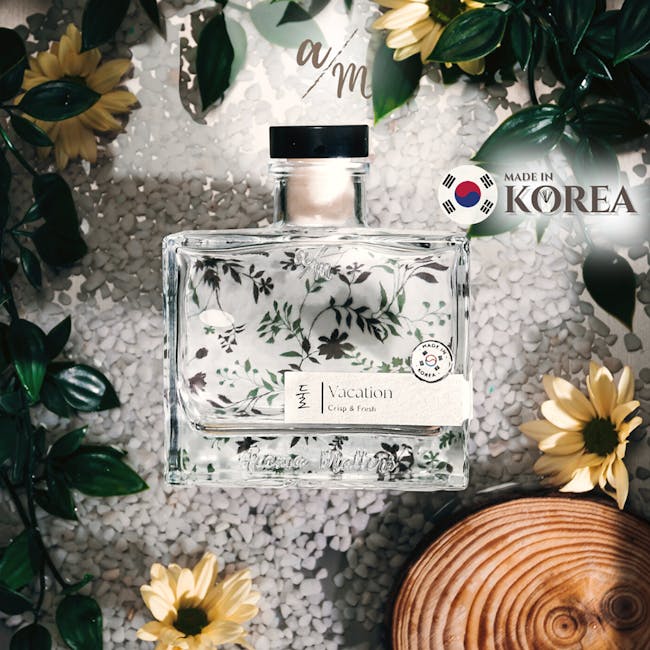 Aroma Matters Reed Diffuser - Vacation (2 Sizes) - 3 - Clear glass bottle with floral design, "Vacation Crisp & Fresh"