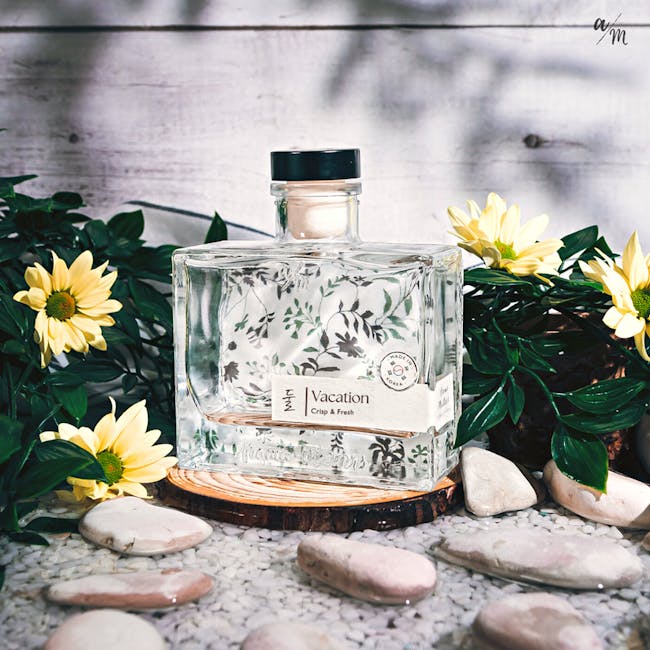 Aroma Matters Reed Diffuser - Vacation (2 Sizes) - 4 - Glass perfume bottle with floral design, "Vacation Crisp & Fresh"