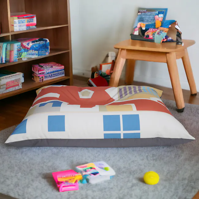 Doob Plopsta' Heritage Collection - Dragon Playground - 5 - Colorful geometric pillow, wooden bookshelf, scattered toys