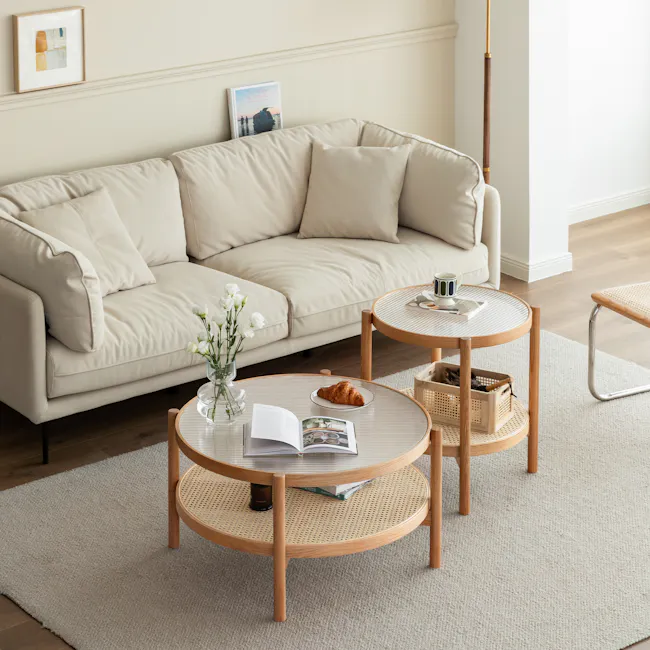 Room setting featuring Lilian Rattan Side Table - Natural (Glass Tabletop)