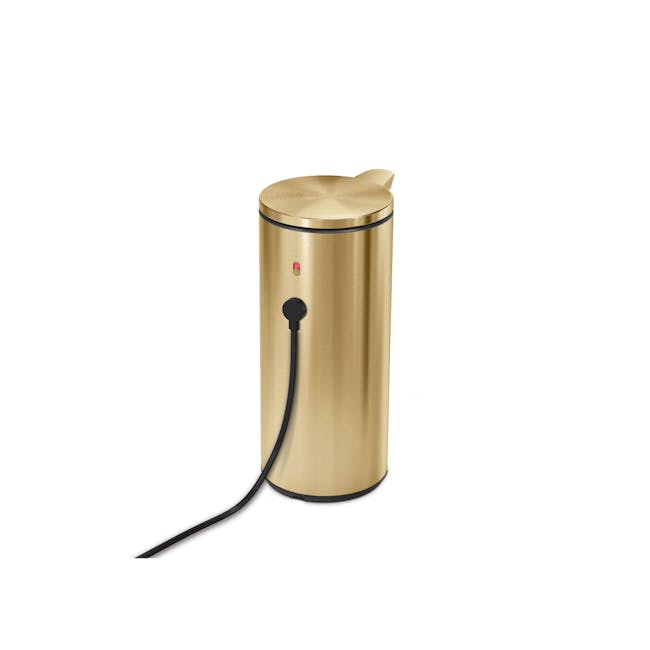 simplehuman 9oz Sensor Pump - Brass - 4 - Golden cylindrical device, sleek design, black cord, red indicator light, modern